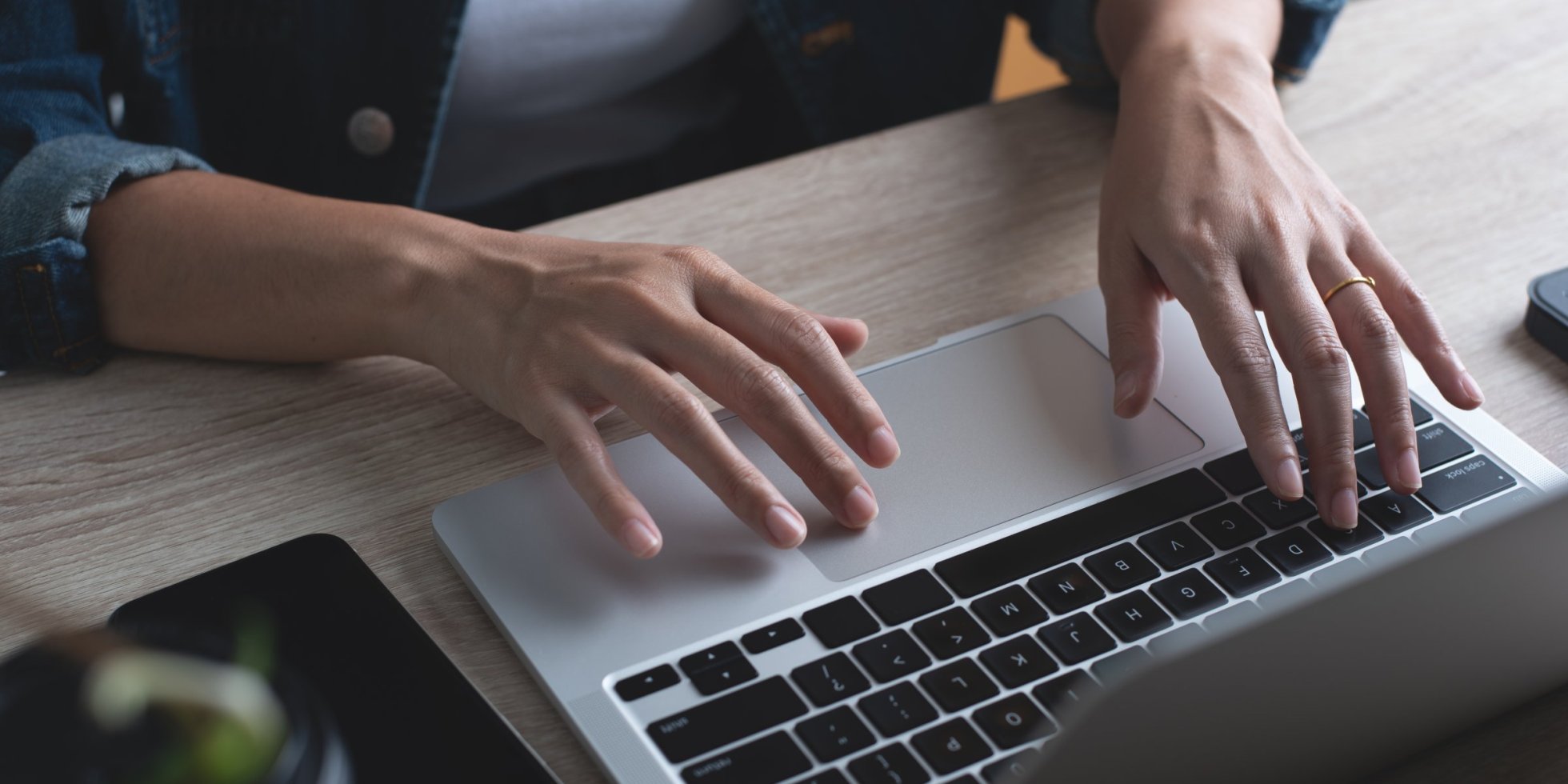 Person typing on laptop